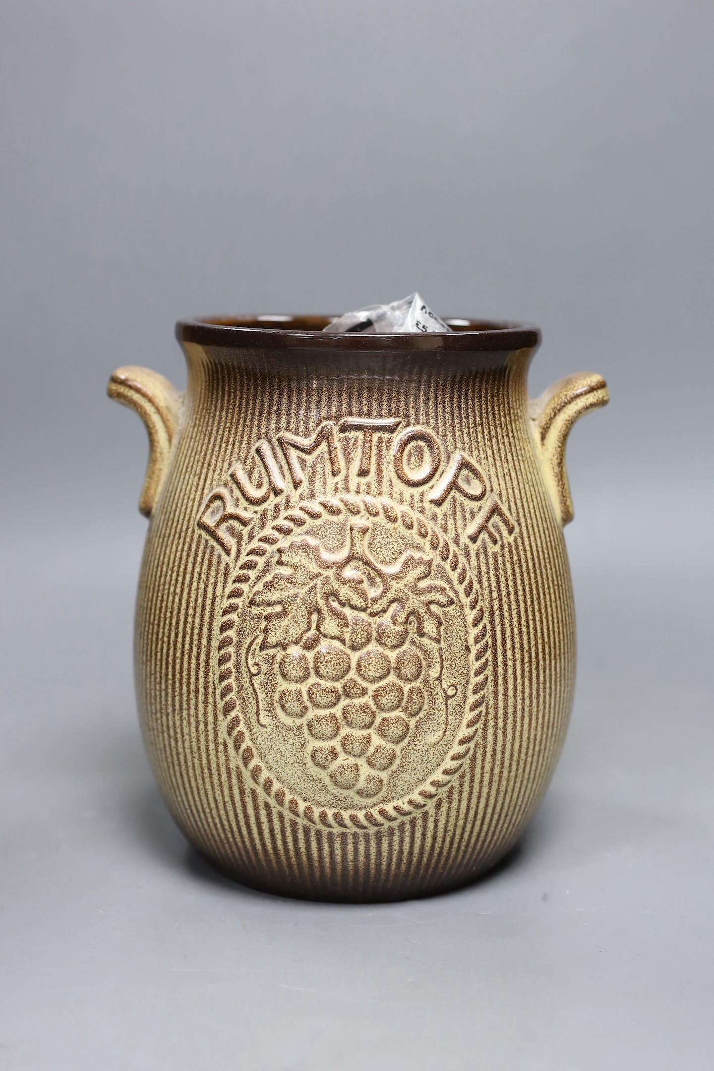 Automobilia, largely badges, in a pottery Rumtopf jar